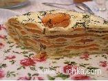 Pancake cake with trout, cheese and avocado