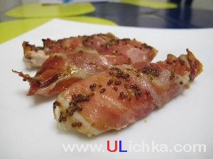 Poultry. Chicken fillet wrapped in bacon.