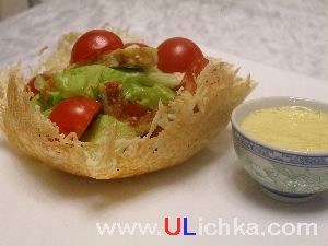 Salad. Chicken salad in a cheese basket with the egg-mustard sauce.