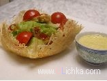 Chicken salad in a cheese basket with the egg-mustard sauce
